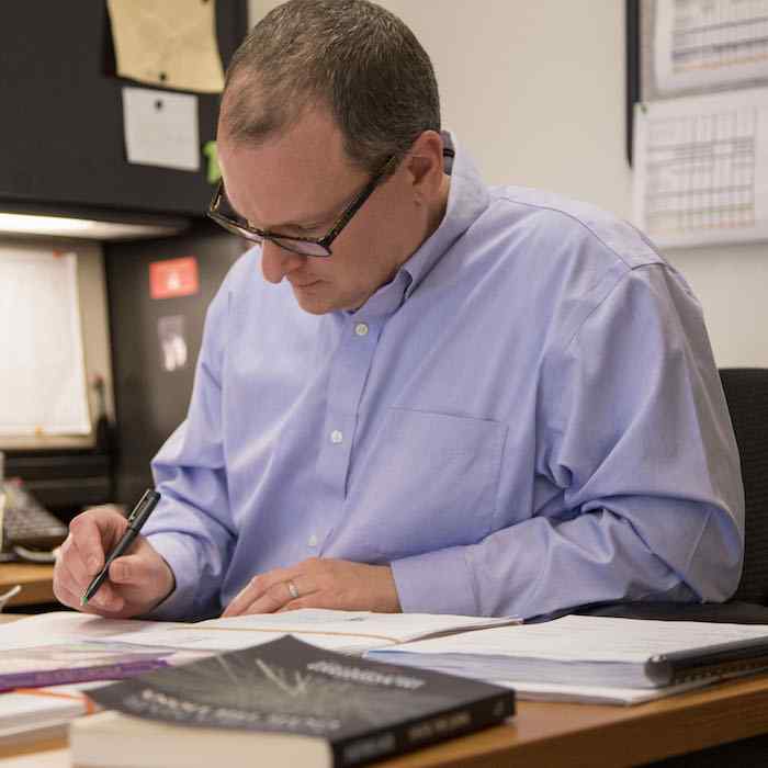 Jeff Shotts editing at his desk