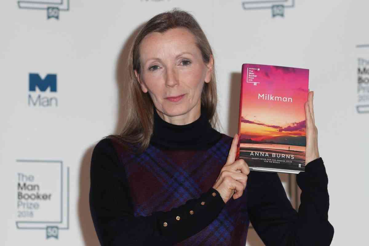 Anna Burns holding her book Milkman